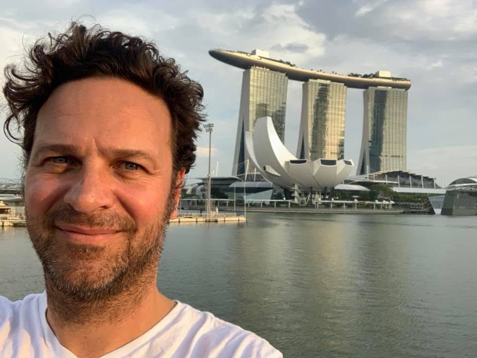 Dennis Goedegebuure at Marina Bay, Singapore, with the ArtScience Museum across the bay
